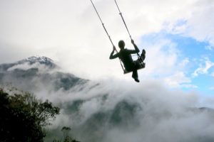 dramatic swing ride in baños in ecuador